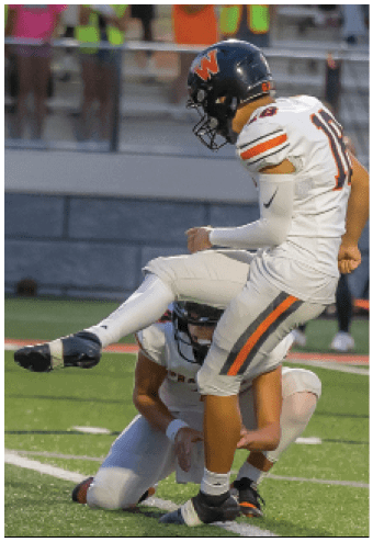 A group of football players celebrating a touchdown. Description generated by AI