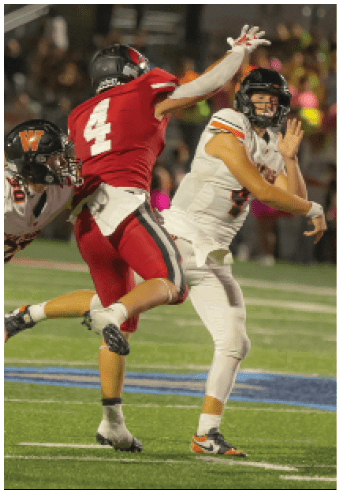A group of football players celebrating a touchdown. Description generated by AI