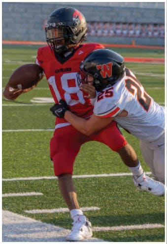 A group of football players celebrating a touchdown. Description generated by AI