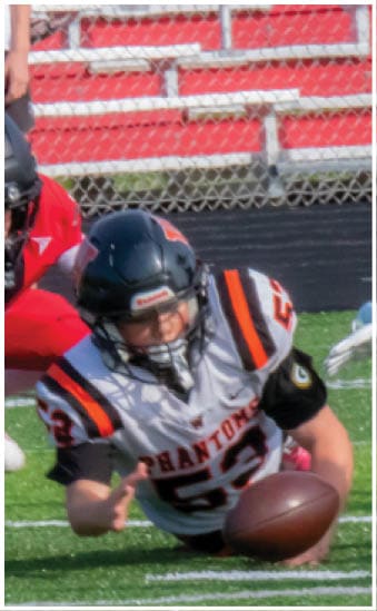 Two football players wearing blue and white uniforms. Description generated by AI