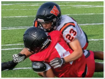A football player running on the field. Description generated by AI