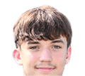 A young man wearing a white jersey with the number 10 on it. Description generated by AI