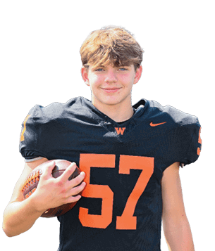 A person wearing black sports pants with an orange “W" and Nike logo is holding a black football helmet with an orange "W" logo. Description generated by AI
