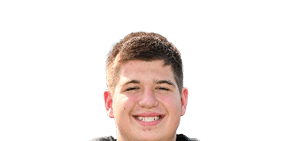 Person wearing a black football jersey with the number 79 in orange, smiling and holding a football. Description generated by AI