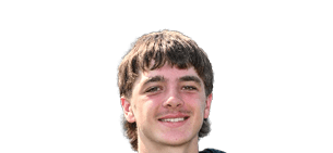 Person with short, slightly wavy hair smiling against a white background. Description generated by AI
