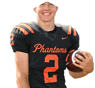 A person wearing a black and orange football jersey with the word Phantoms and the number 2 is smiling and holding a football. Description generated by AI