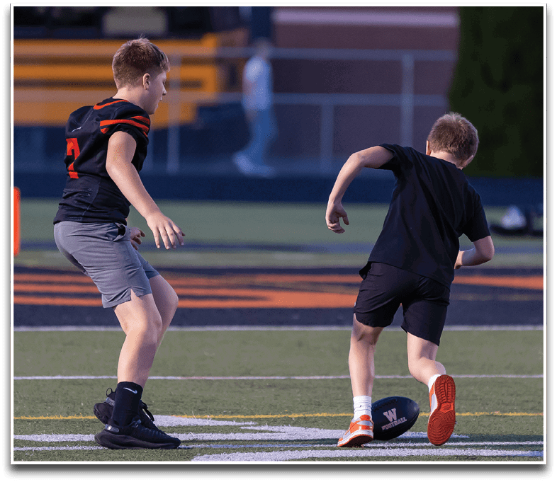 Three football players are standing on the field, one of them is smiling and wearing a black jersey with the number 55. AI generated content
