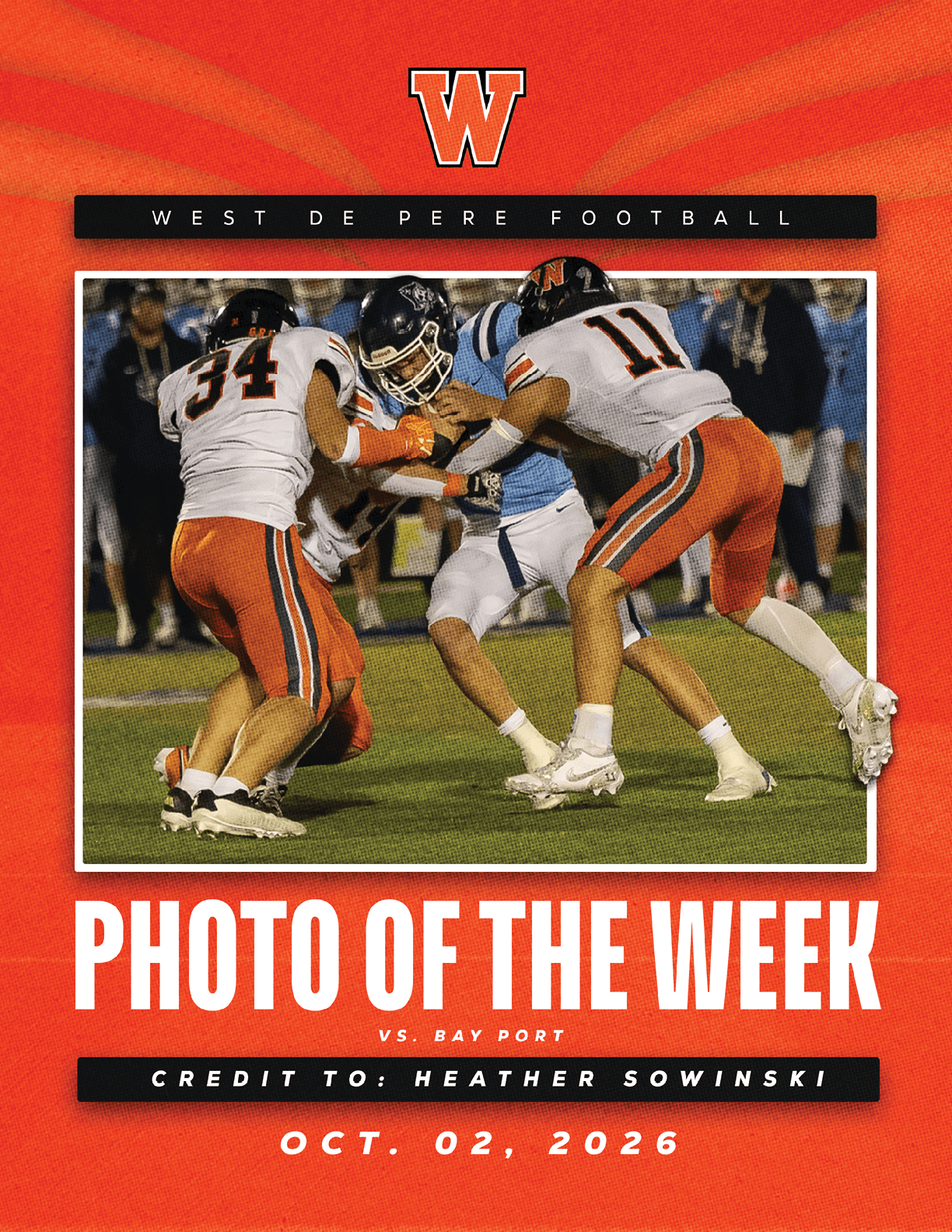 Two football players in white and orange uniforms tackle a player in a light blue uniform during a game, with text highlighting the photo as the “Photo of the Week" for West De Pere Football against Bay Port on October 2, 2026. Description generated by AI