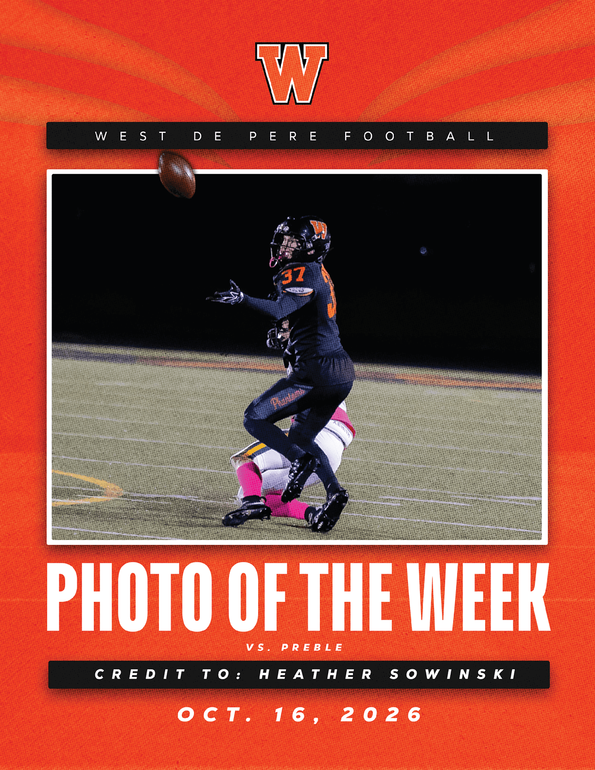 A person in a black football uniform with the number 37 is catching a football on a field while another person in a white and pink uniform is on the ground behind them, with text indicating this is the West De Pere Football photo of the week for October 16, 2026. Description generated by AI