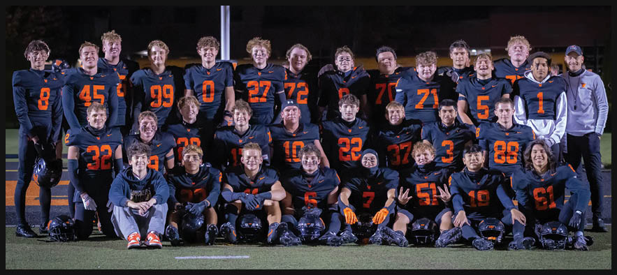 Three football players are standing on the field, one of them is smiling and wearing a black jersey with the number 55. AI generated content