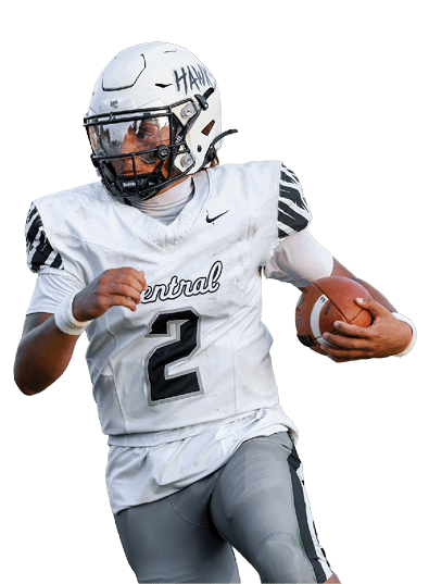 A person wearing a white football uniform with the number 2 is running on a grassy field while holding a football. Descripci n generada con IA