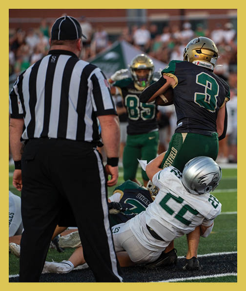A football player in a white uniform is running with a football in his hand. AI generated content