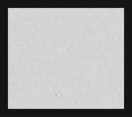 A white wall with a gray border. Description generated by AI
