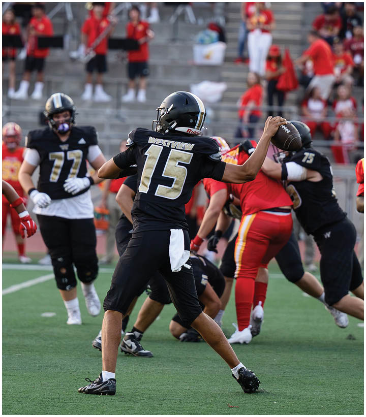 A group of football players wearing black and white uniforms. Description generated by AI