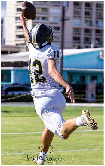 A football player running on the field. Description generated by AI