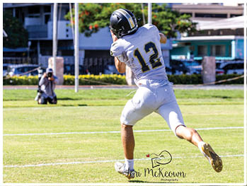 A football player running on the field. Description generated by AI