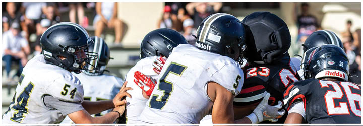 A group of football players on a field. Description generated by AI