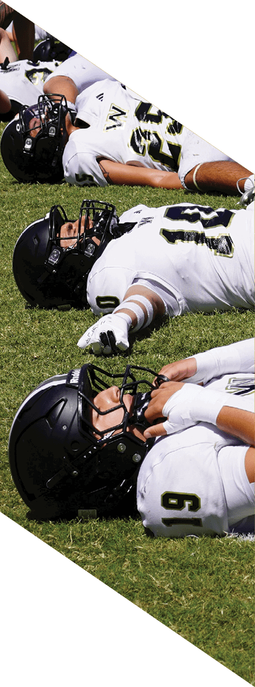 Two young men wearing football uniforms and making hand gestures. AI generated content