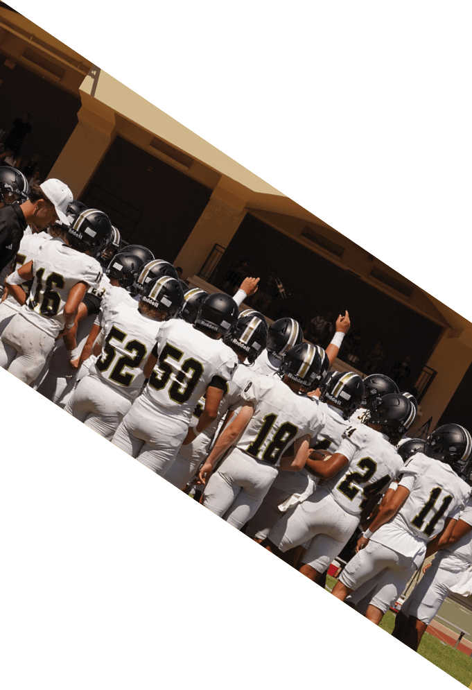 Four football players pose for a picture on the field. AI generated content