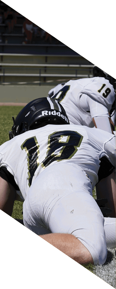 A football player wearing a helmet and white uniform is holding his helmet above his head. AI generated content
