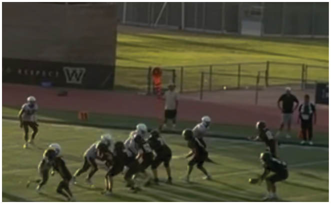 A group of football players in black and white uniforms are on the field. AI generated content