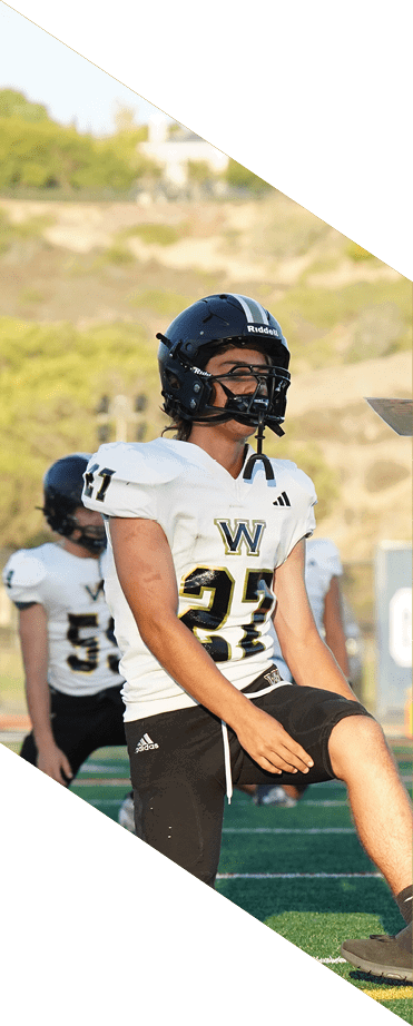 A football player wearing a helmet and white uniform is holding his helmet above his head. AI generated content