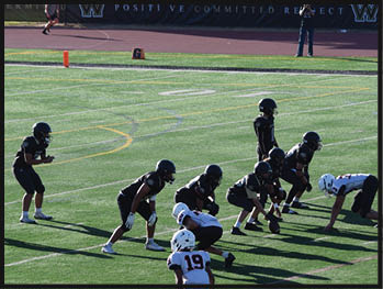A football player running on the field. Description generated by AI