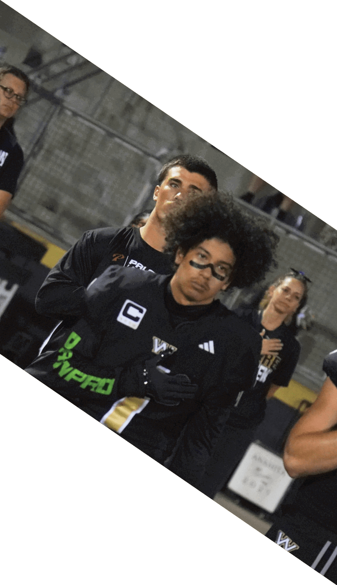 A football team is gathered around a coach, listening to his instructions. AI generated content