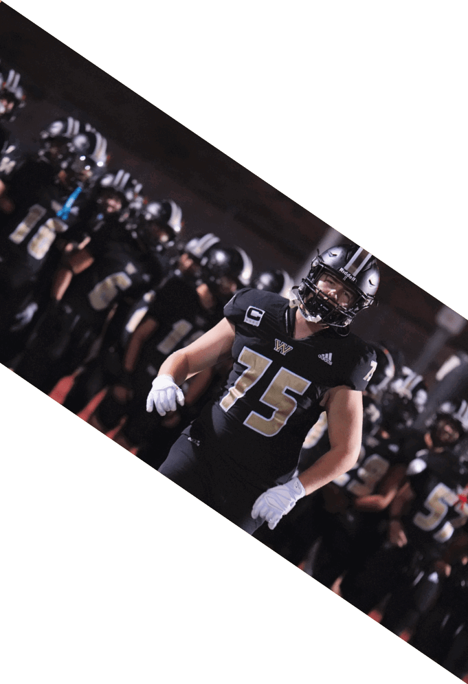 Four football players pose for a picture on the field. AI generated content