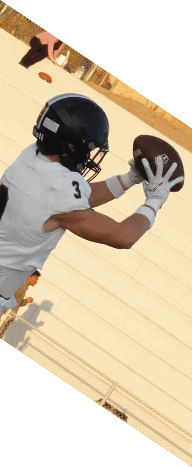 A person wearing a white sports uniform with the number 8 is running on a football field near the 10-yard marker. Description generated by AI