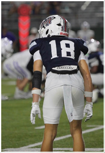 A group of football players celebrating a touchdown. Description generated by AI
