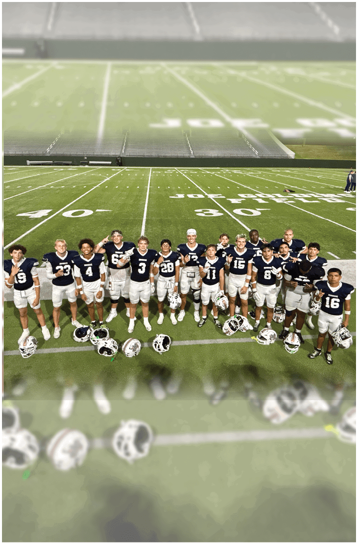 A group of football players on a field. Description generated by AI
