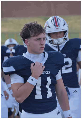 A group of football players celebrating a touchdown. Description generated by AI