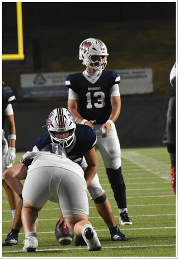 A group of football players celebrating a touchdown. Description generated by AI