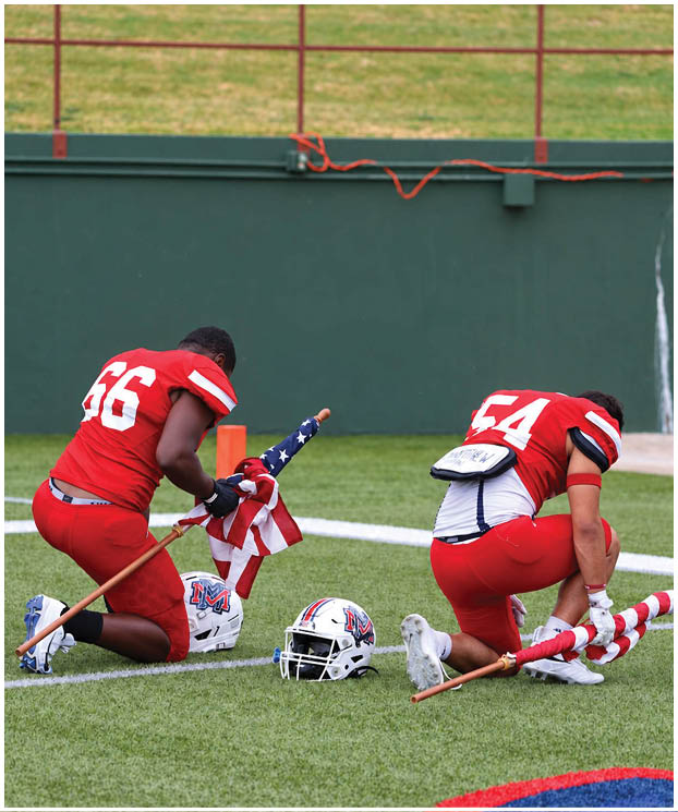 A group of football players on a field. Description generated by AI
