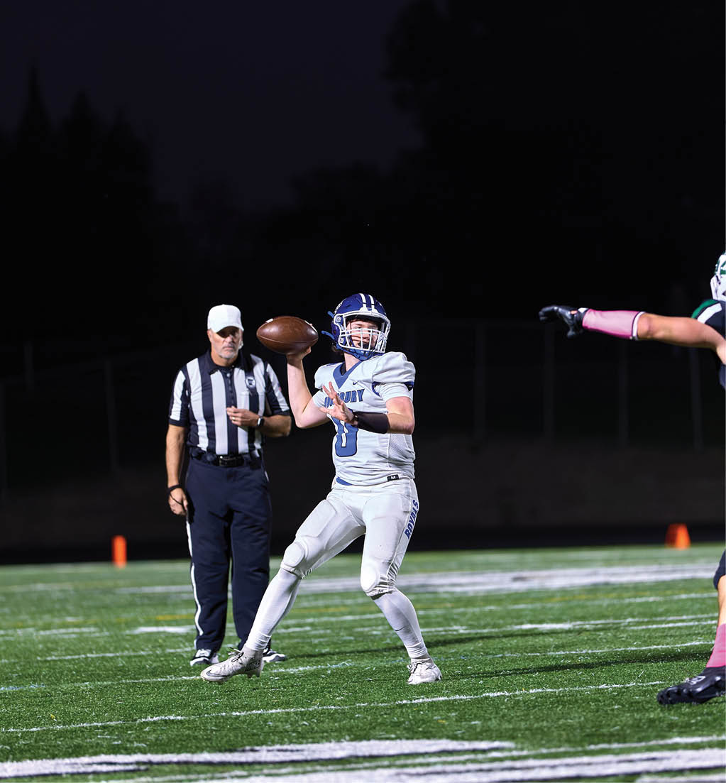 A football player in a white jersey with the number 16 on it. Description generated by AI