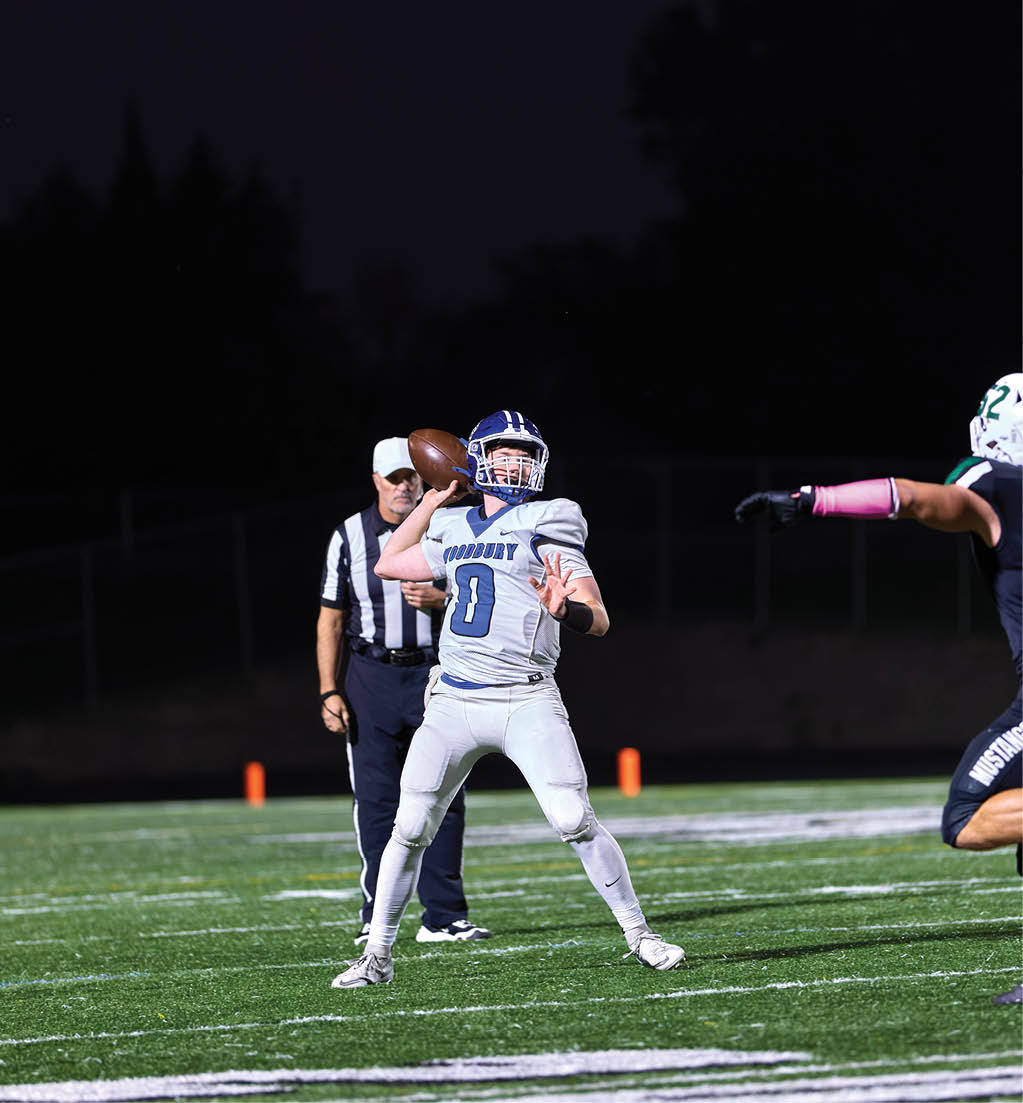 A football player in a white jersey with the number 16 on it. Description generated by AI