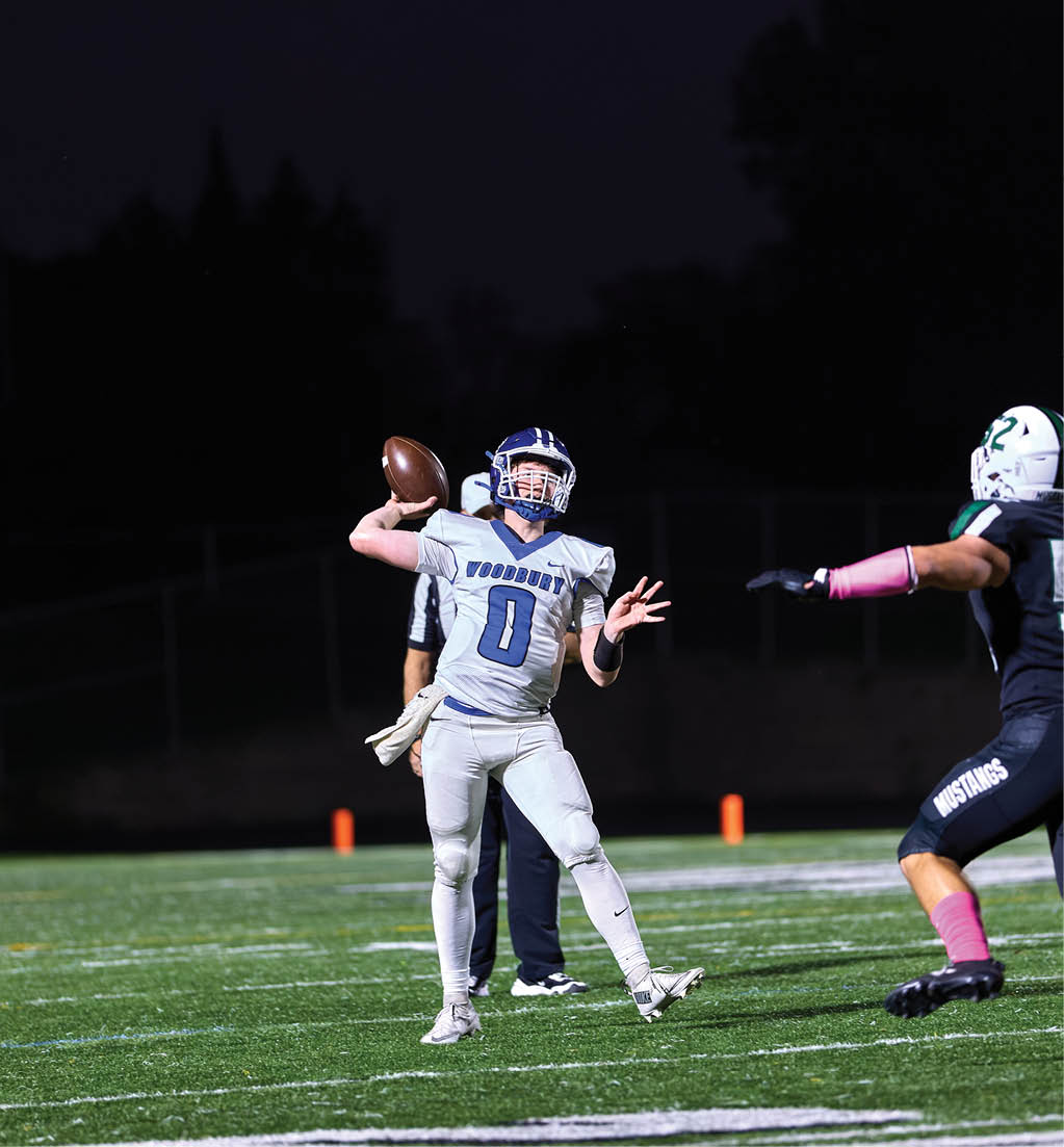 A football player in a white jersey with the number 16 on it. Description generated by AI