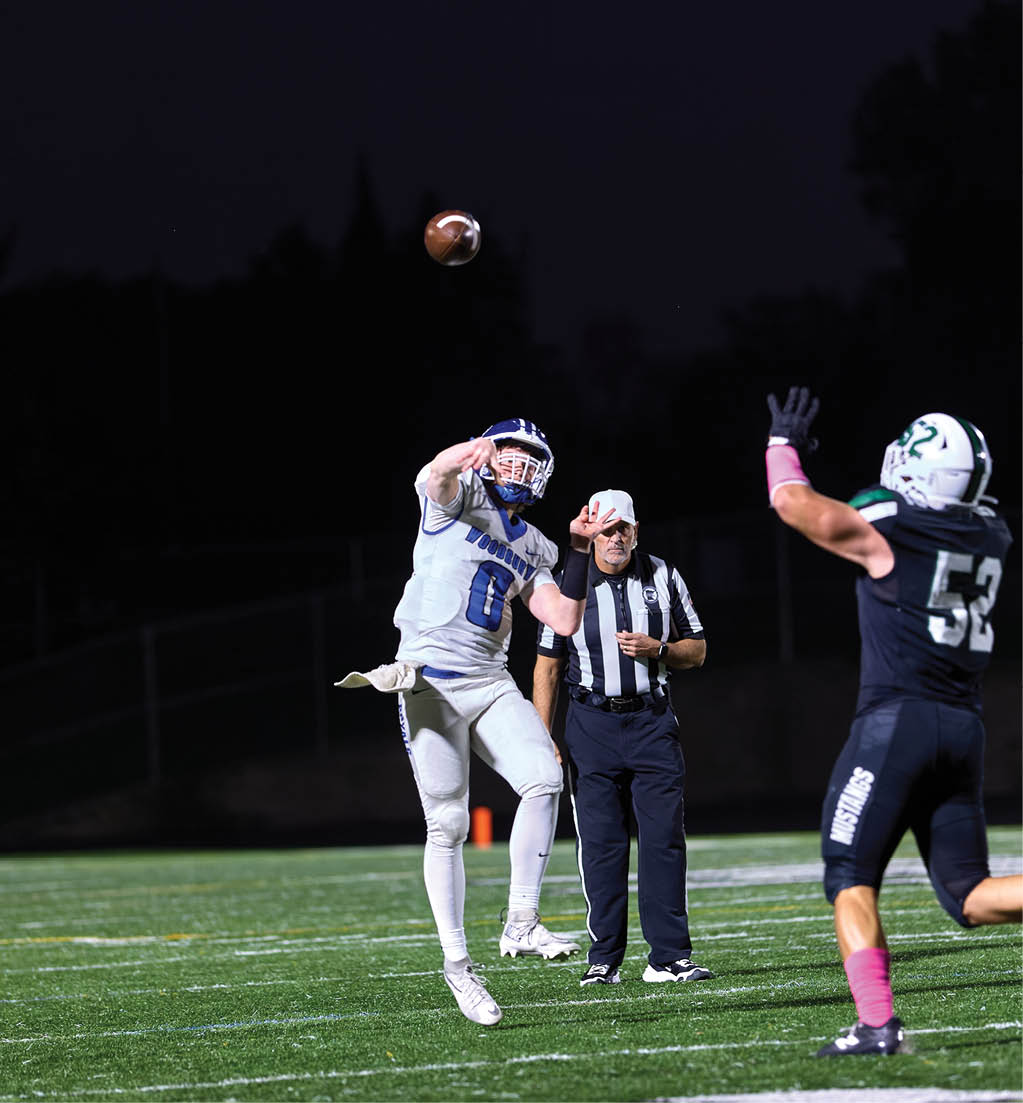 A football player in a white jersey with the number 16 on it. Description generated by AI