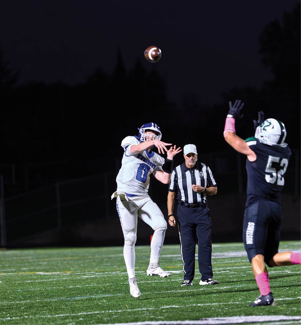 A football player in a white jersey with the number 16 on it. Description generated by AI
