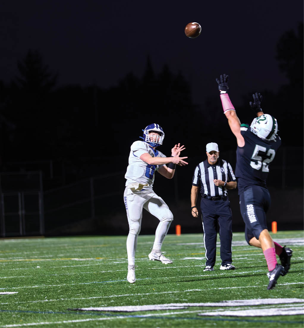 A football player in a white jersey with the number 16 on it. Description generated by AI