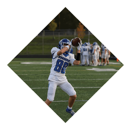 A football player wearing a black jersey with the number 16 on it is holding a football. AI generated content