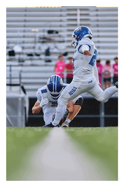 A football player wearing a black and white uniform with the number 10 on the back. AI generated content