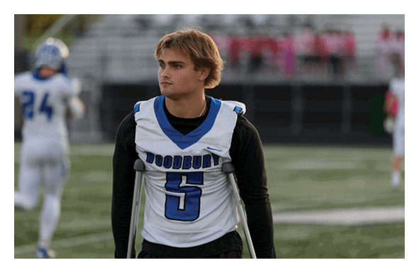 A group of football players wearing headphones and smiling. AI generated content