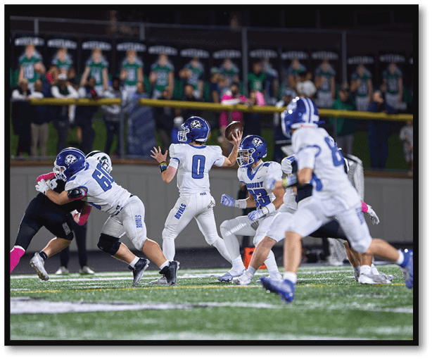 A group of football players wearing black jerseys with the number 3 on them. Description generated by AI