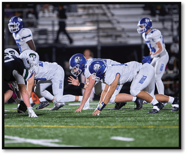 A group of football players wearing black jerseys with the number 3 on them. Description generated by AI