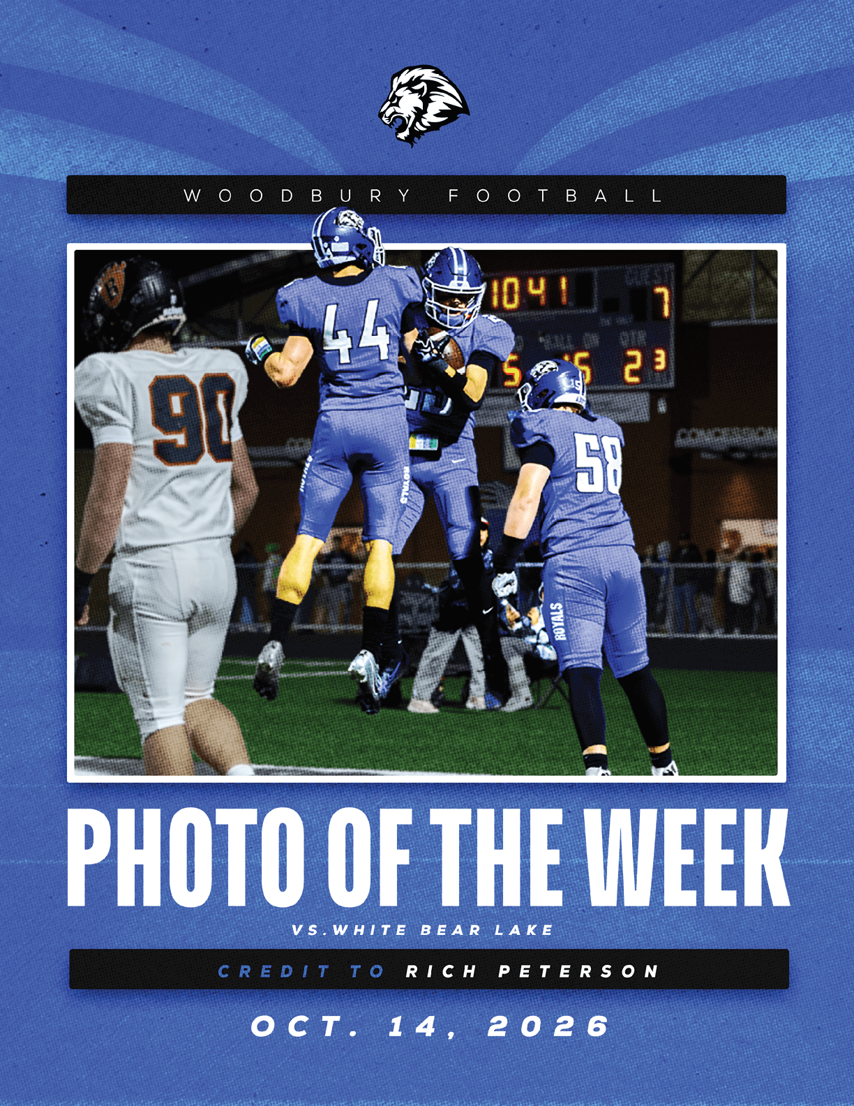 A football player wearing a blue and white uniform. Description generated by AI