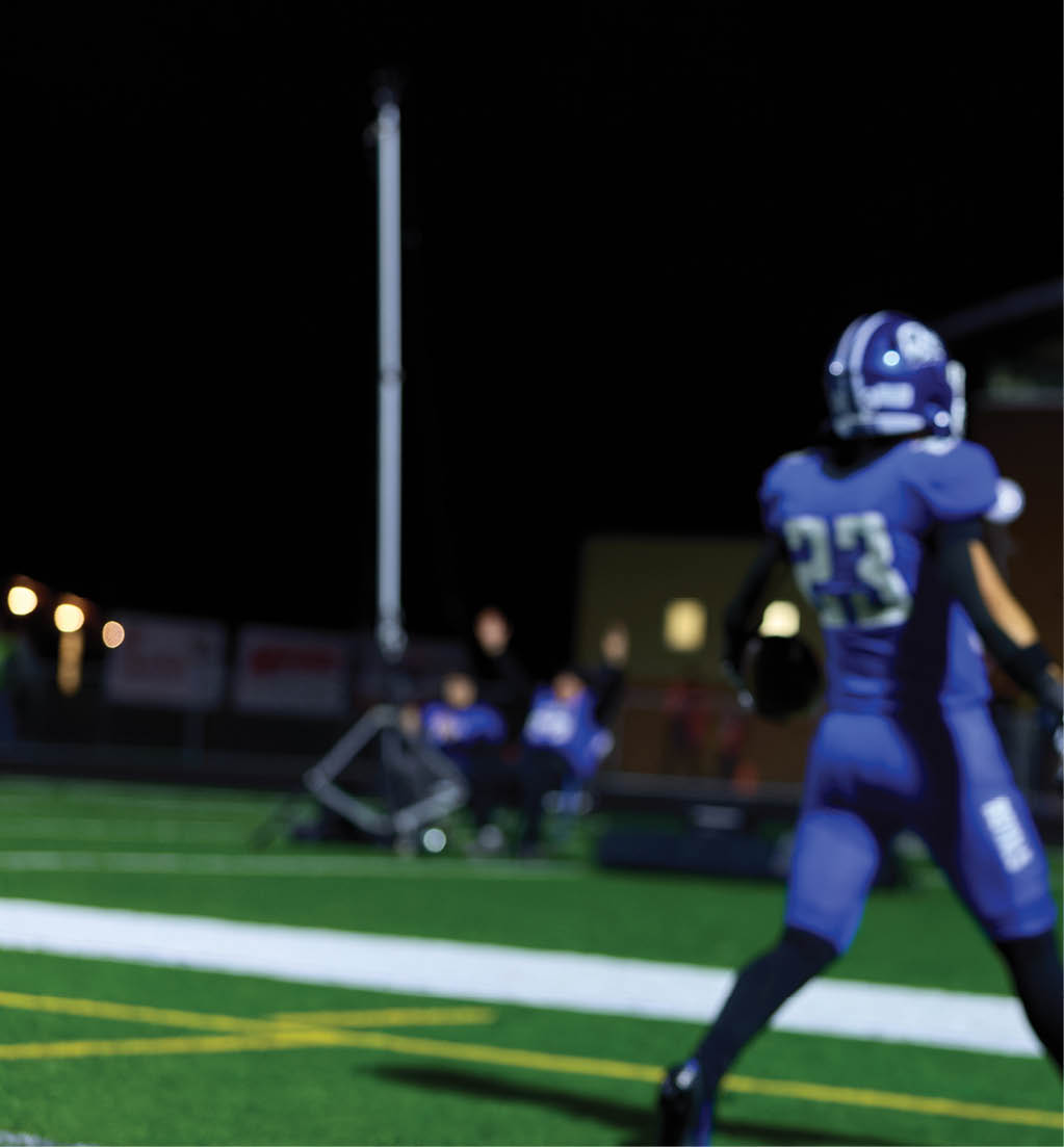 A football player in a white jersey with the number 16 on it. Description generated by AI