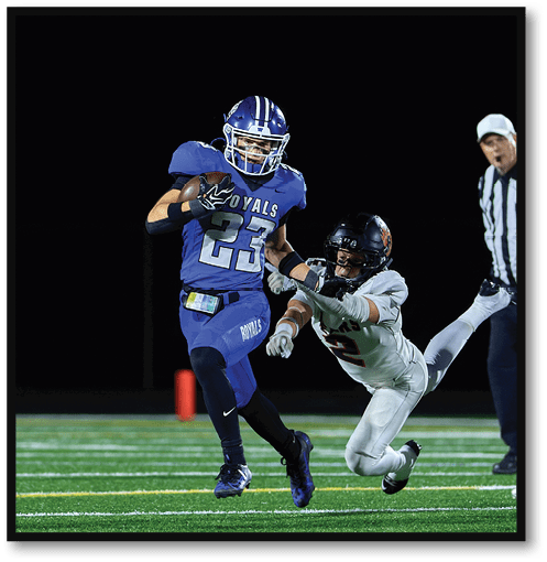 Two football players wearing black jerseys with the number 11 on them. Description generated by AI