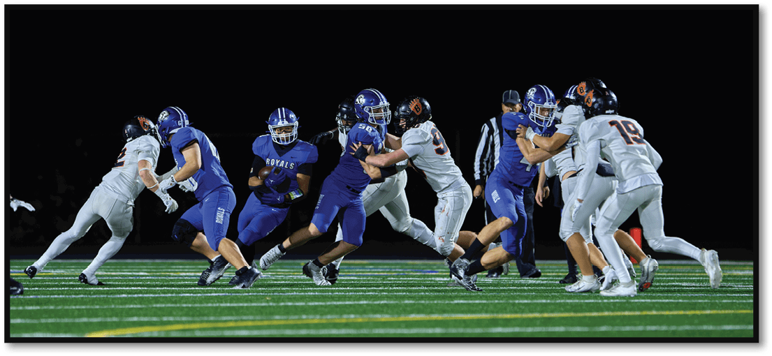 A football player running on the field. Description generated by AI